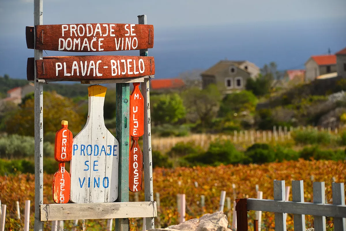 Wooden board with an inscription about the sale of wine and oil in the inland of the island of Vis