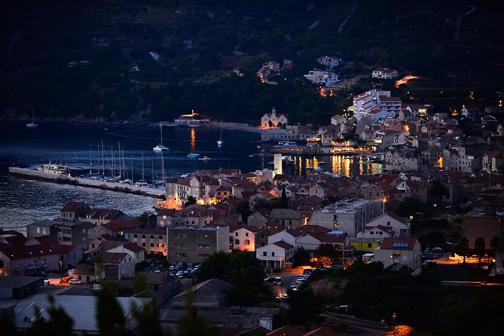 Panoramic shot of the bay of the town of Komiža on the island of Vis at night